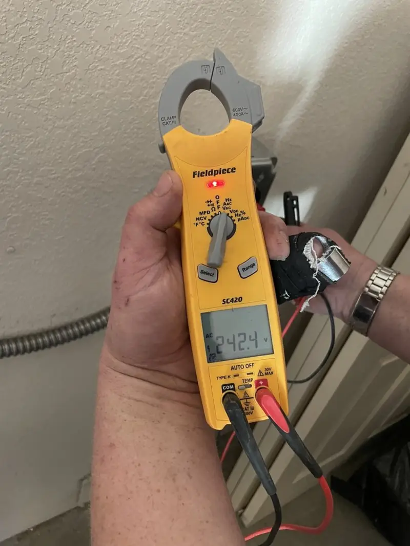Voltage testing with clamp meter during Electrical Installation Services in Jamestown